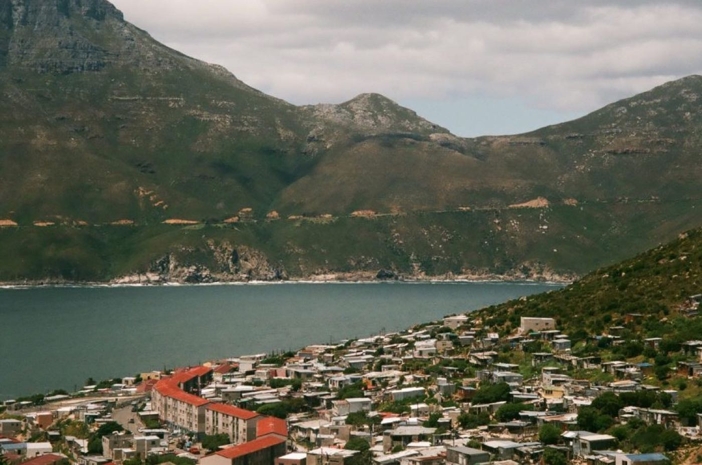 Hangberg on the western side of Hout Bay, with the mountain slopes the Karbonkelberg routes climb rising behind it.
