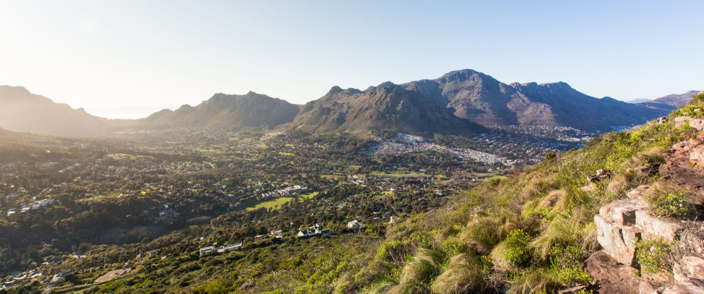 The Hout Bay valley seen from the Little Lion's Head path, low sun across the ridges.
